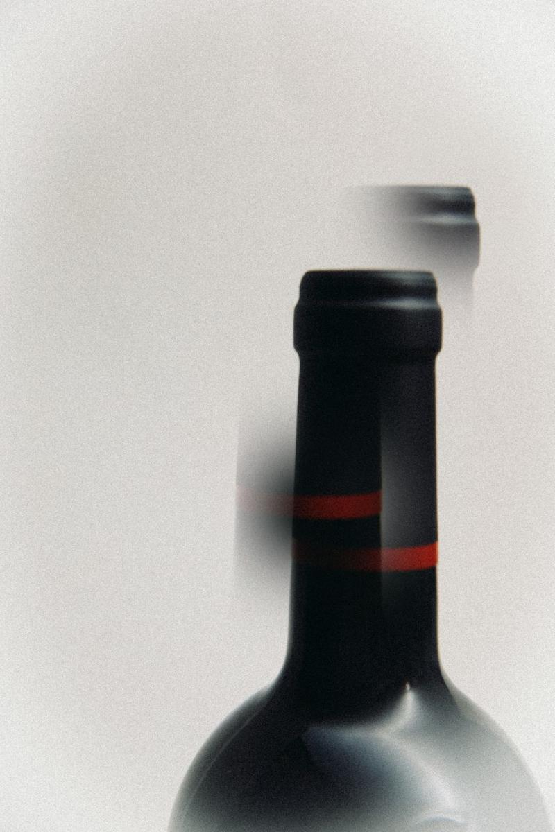 Multiple exposure of capsule of bottle of Chateau Clinet