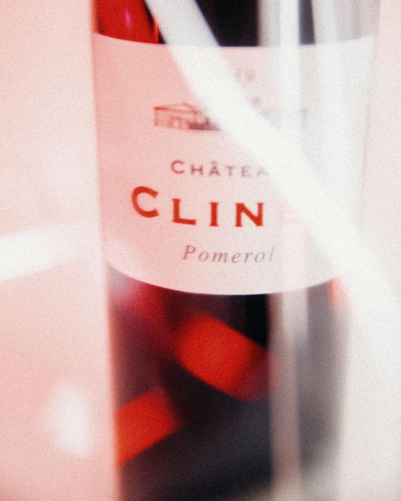 Chateau Clinet label seen behind carafe with red light flickers