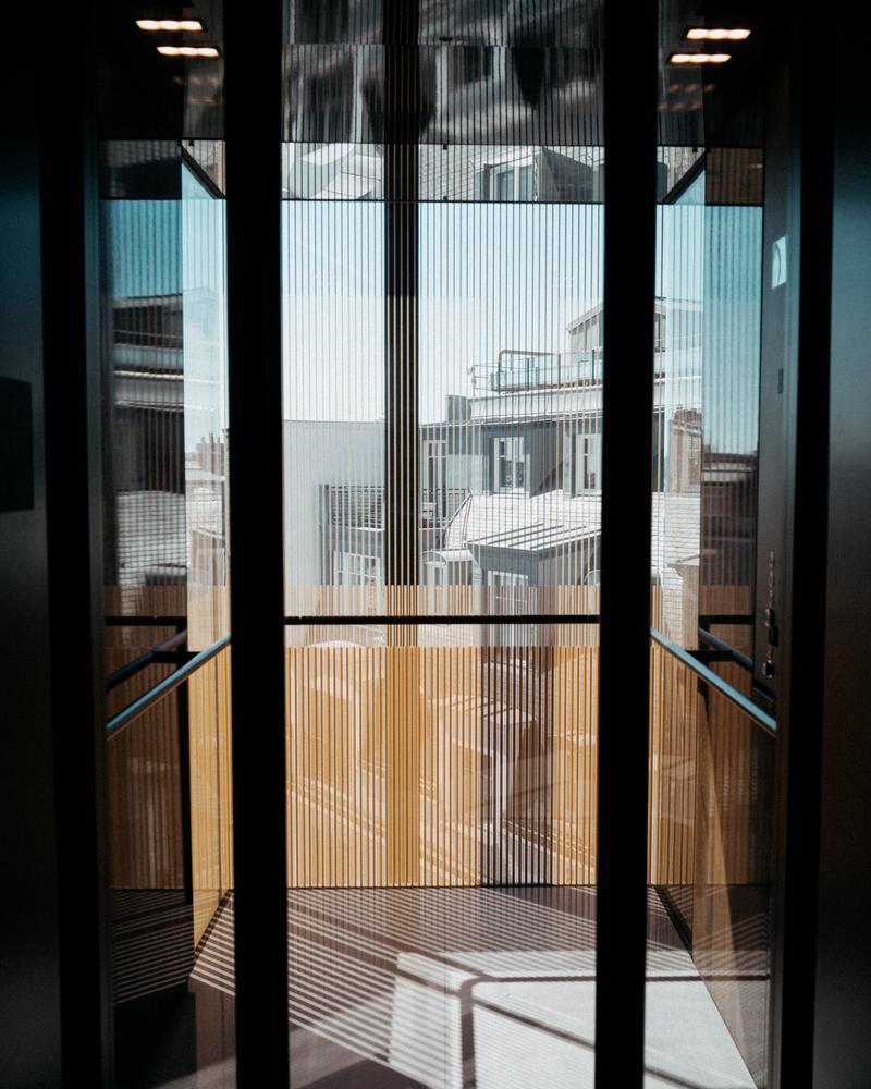 View through lift doors onto courtyard at Hotel Lutetia